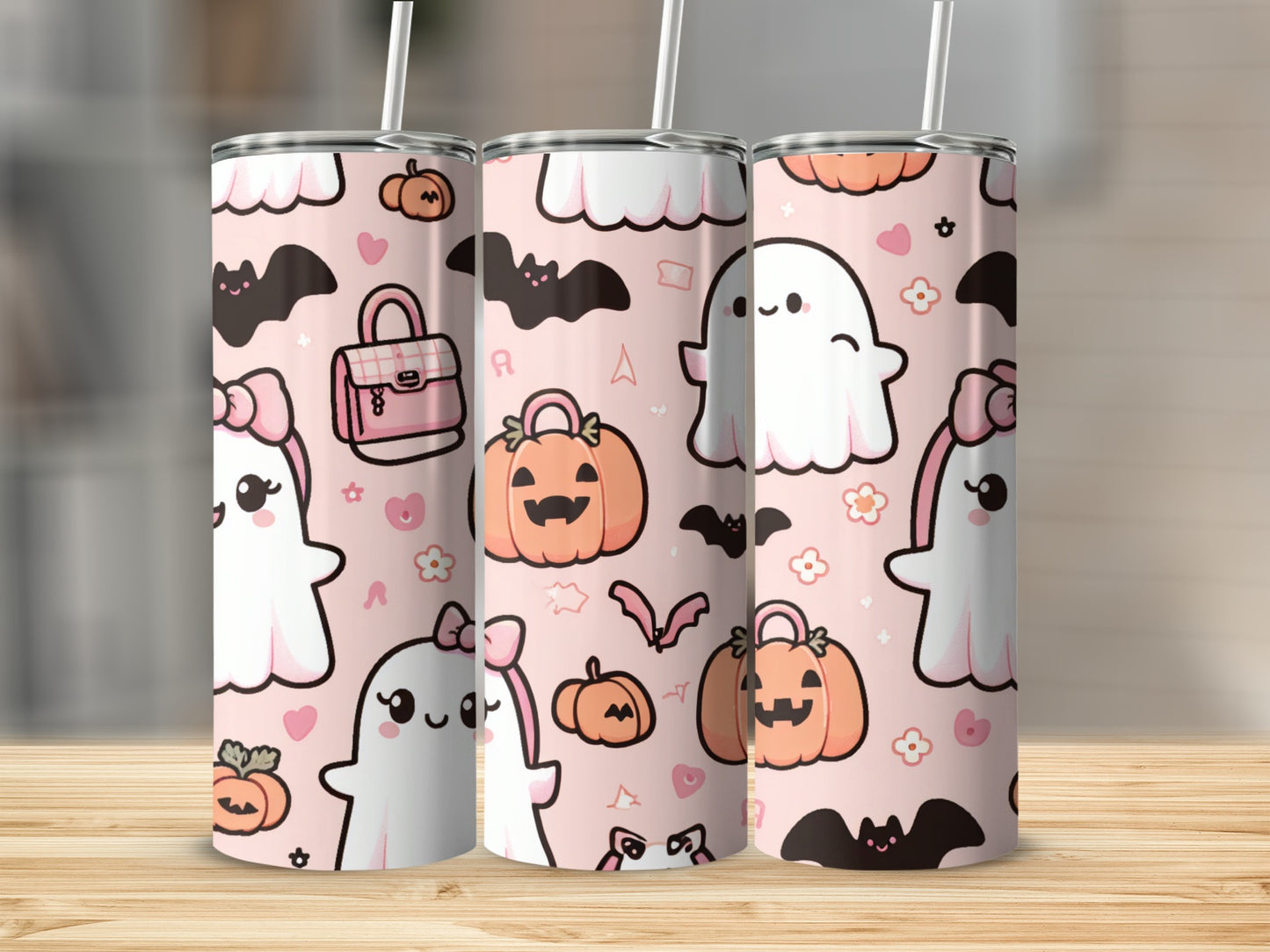 Three tumblers with a pink, Halloween-themed pattern of ghosts, pumpkins, and bats.