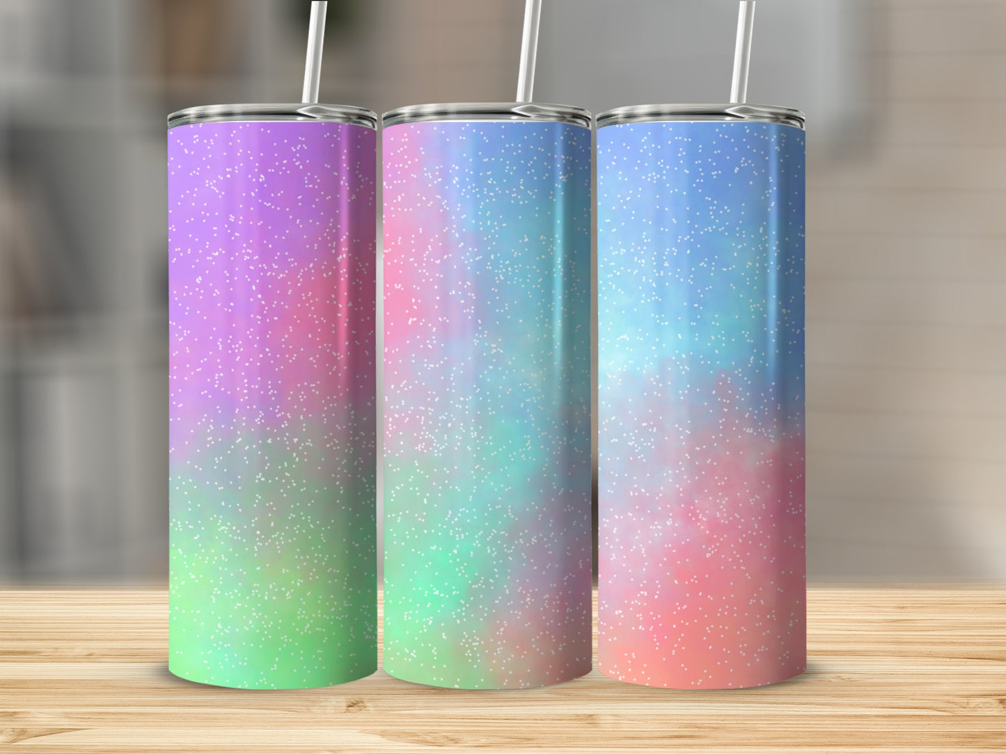Three tumblers with purple, blue, and pink glitter patterns.
