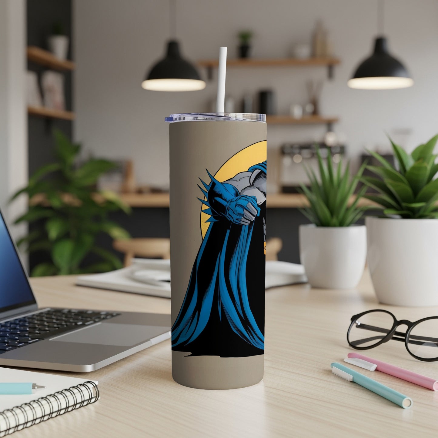 Batman leaning forward in blue cape, against a yellow circle.