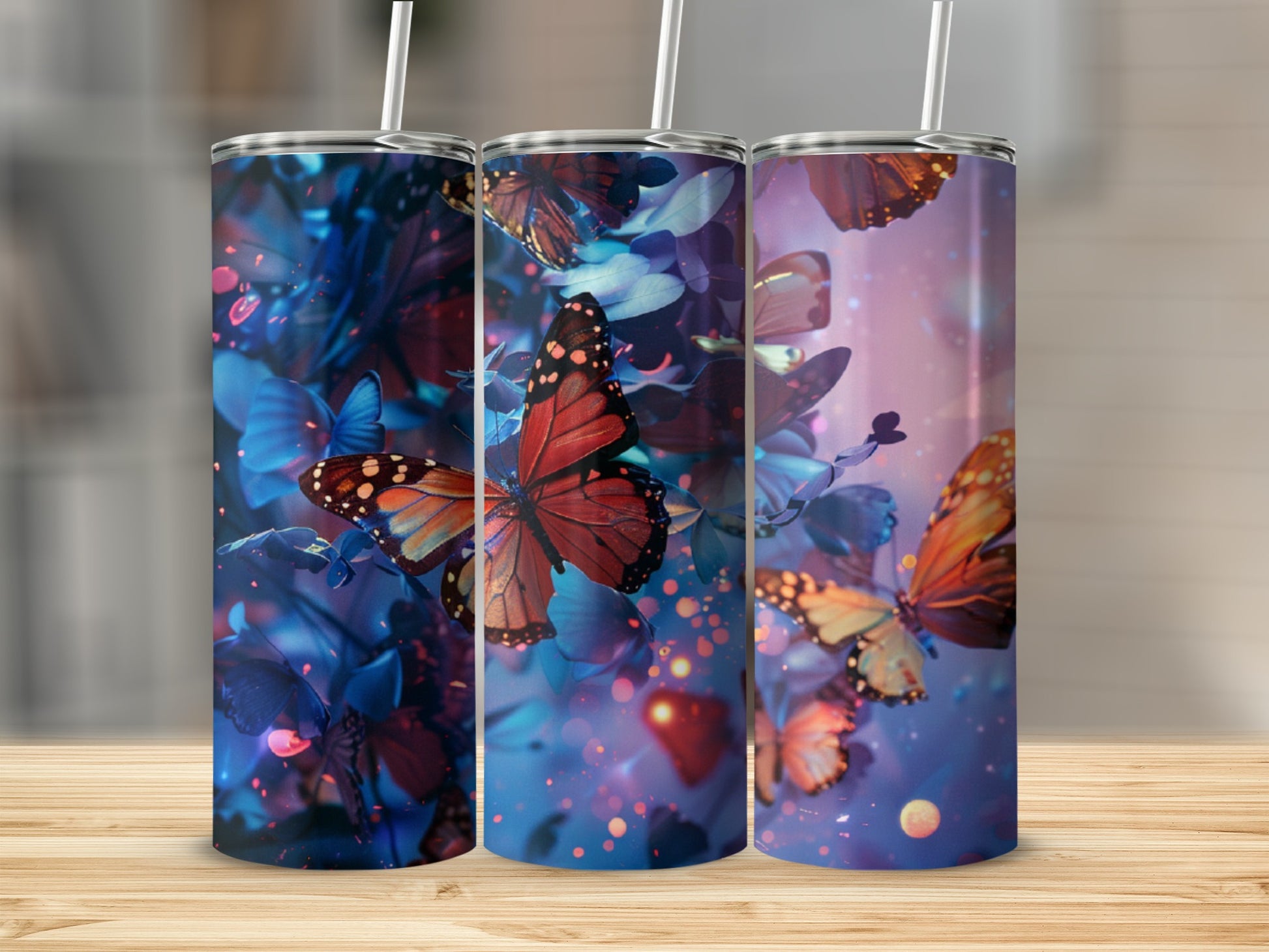 Three tumblers feature a dark blue floral background with orange and yellow butterflies.