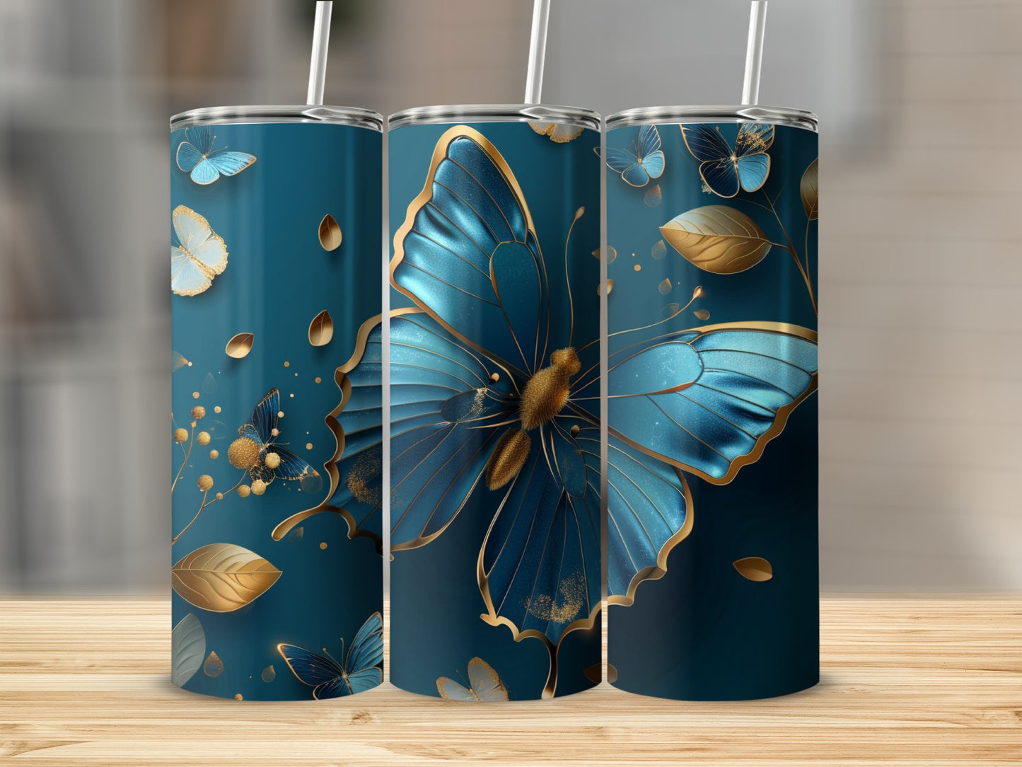 Three dark blue tumblers with gold butterfly and leaf designs.