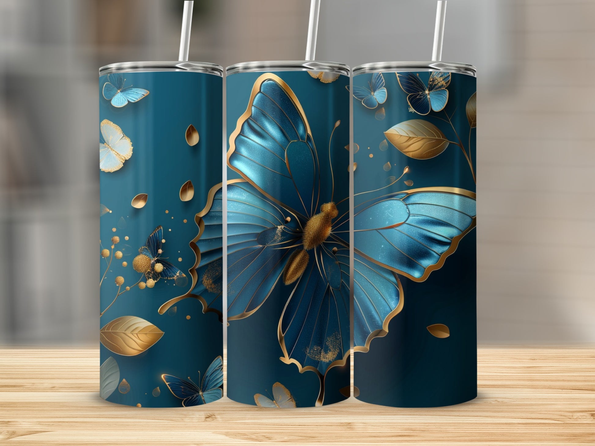 Three dark blue tumblers with gold butterfly and leaf designs.