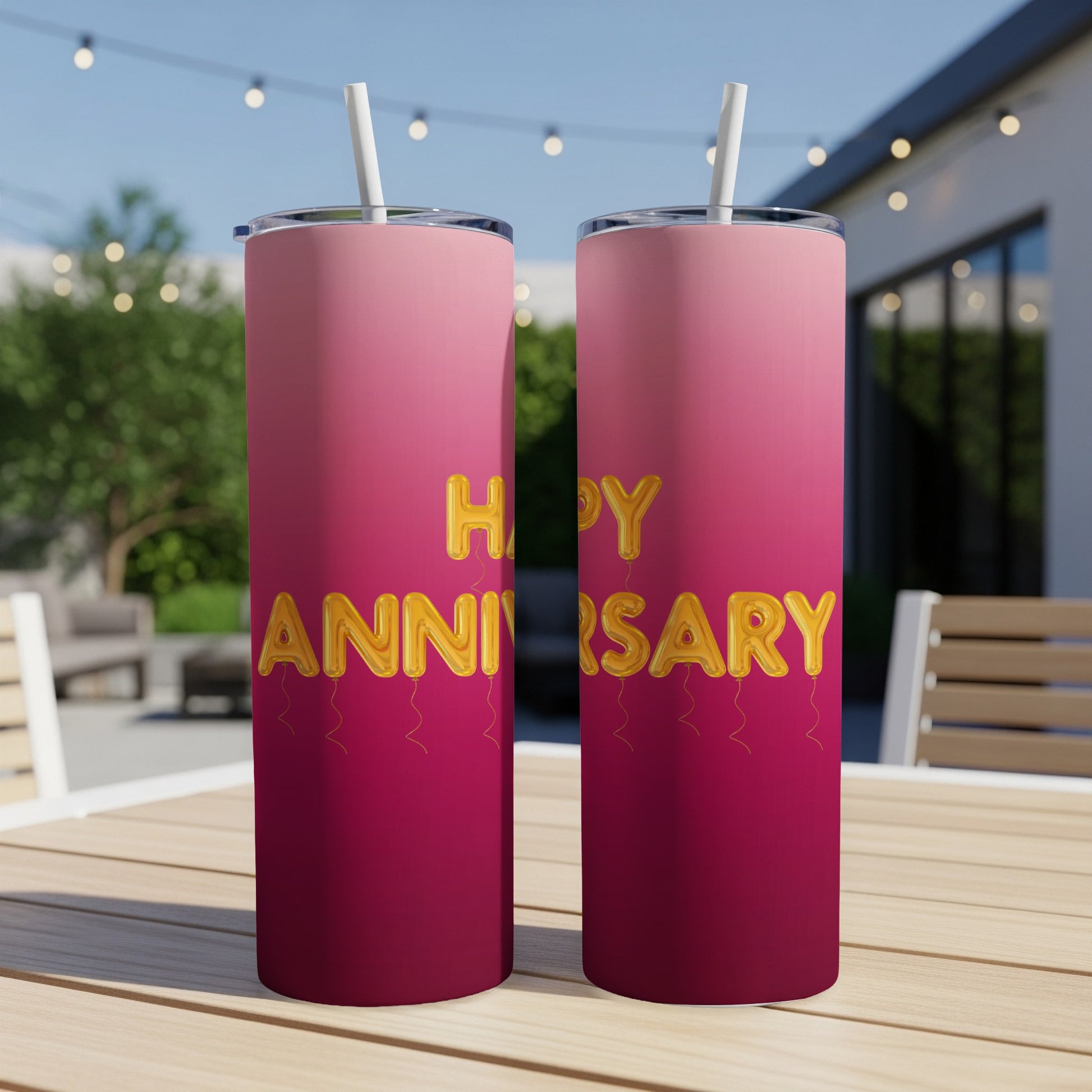 Two pink and red tumblers with "Happy Anniversary" balloons text.