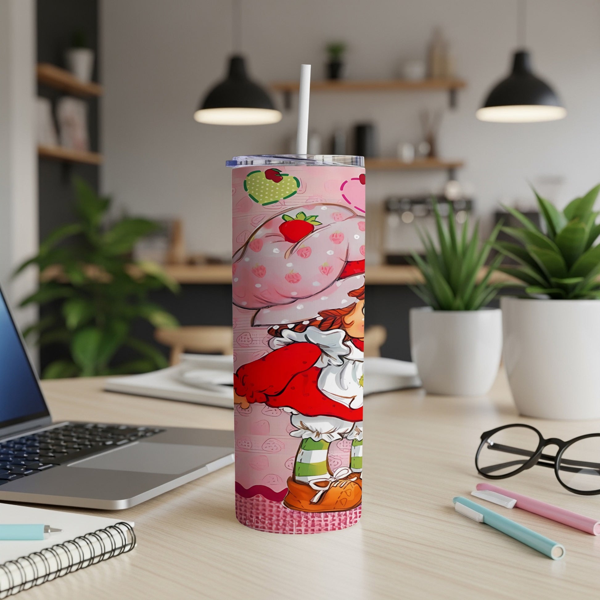 Strawberry Shortcake tumbler with a pink patterned background.