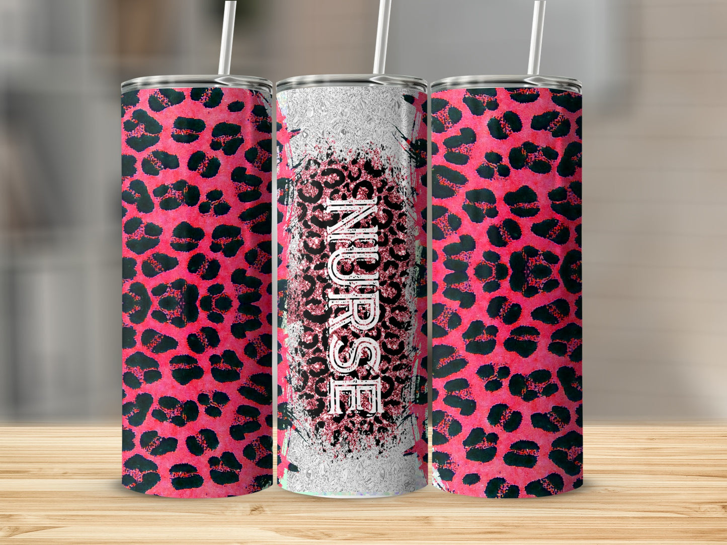 Pink leopard print tumbler with "Nurse" text, standing on a wooden surface.