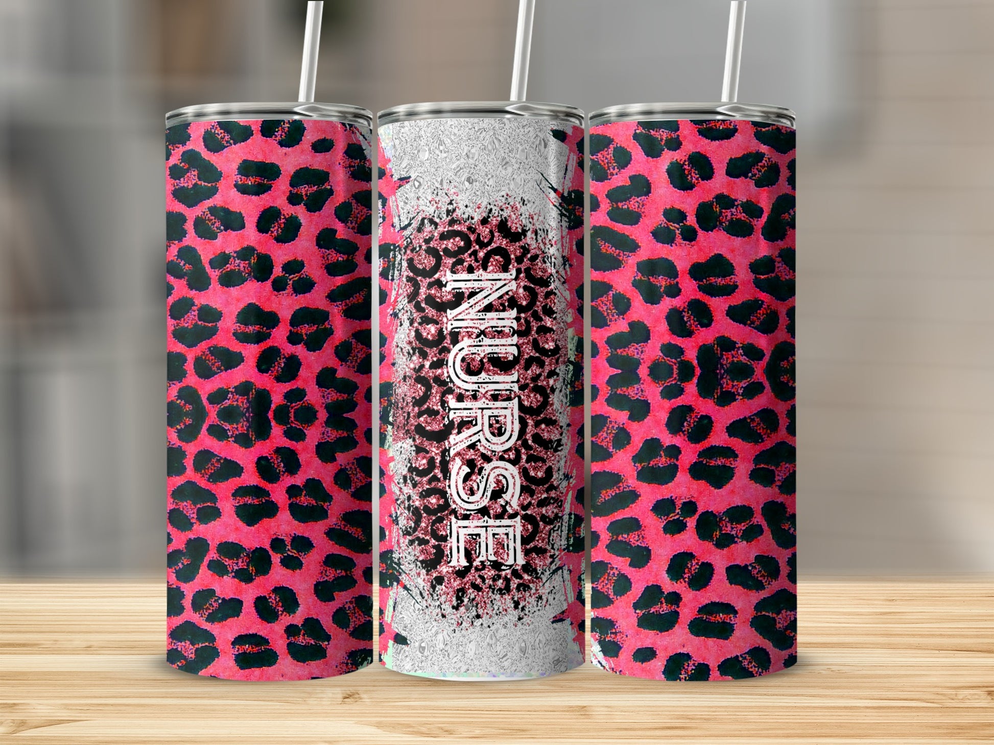 Pink leopard print tumbler with "Nurse" text, standing on a wooden surface.