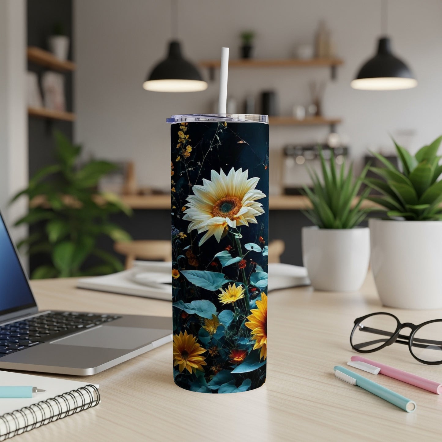 Tall tumbler with sunflowers and dark floral pattern.