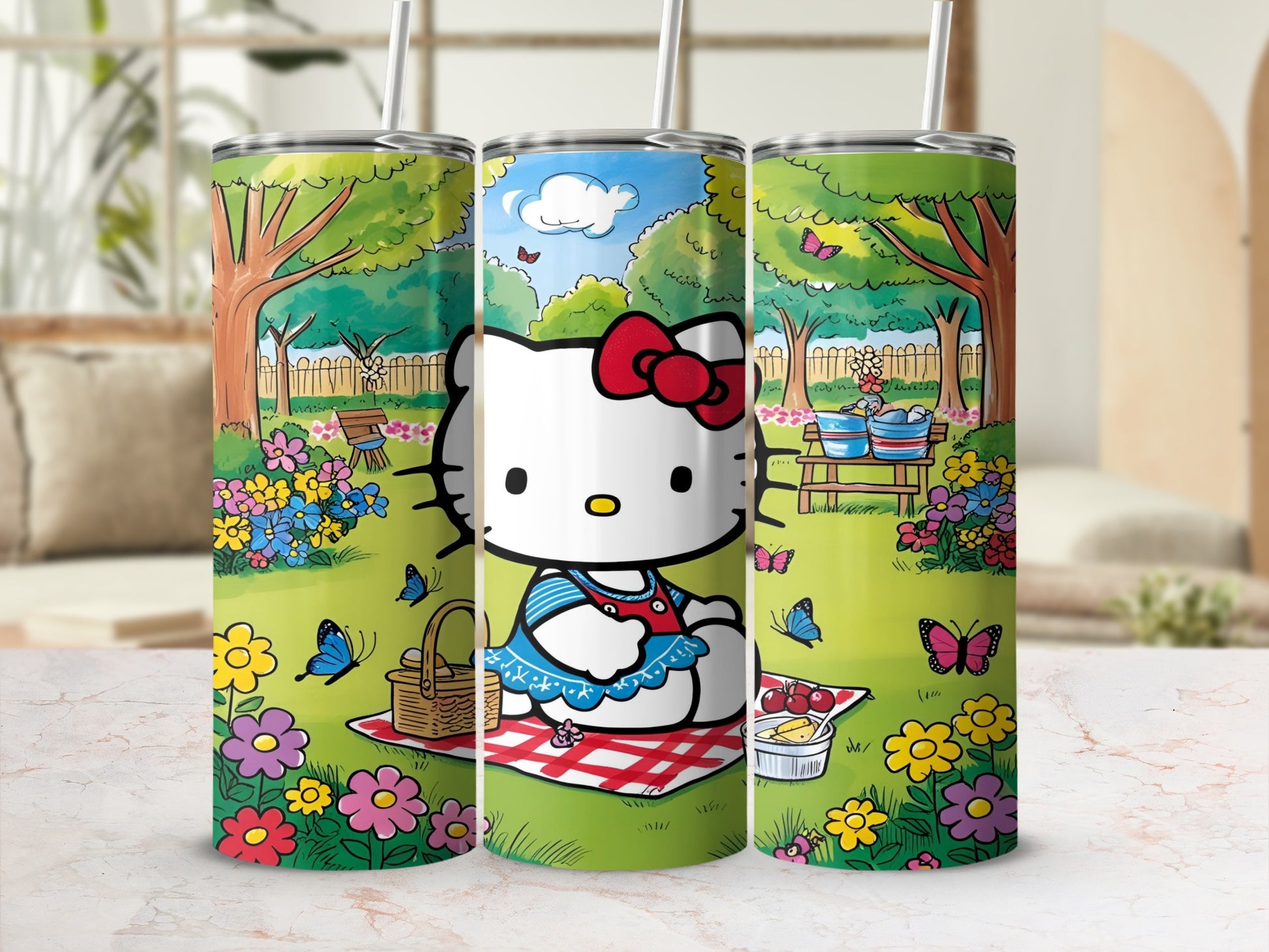 Hello Kitty picnic scene on a stainless steel tumbler with straw.