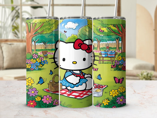 Hello Kitty picnic scene on a stainless steel tumbler with straw.