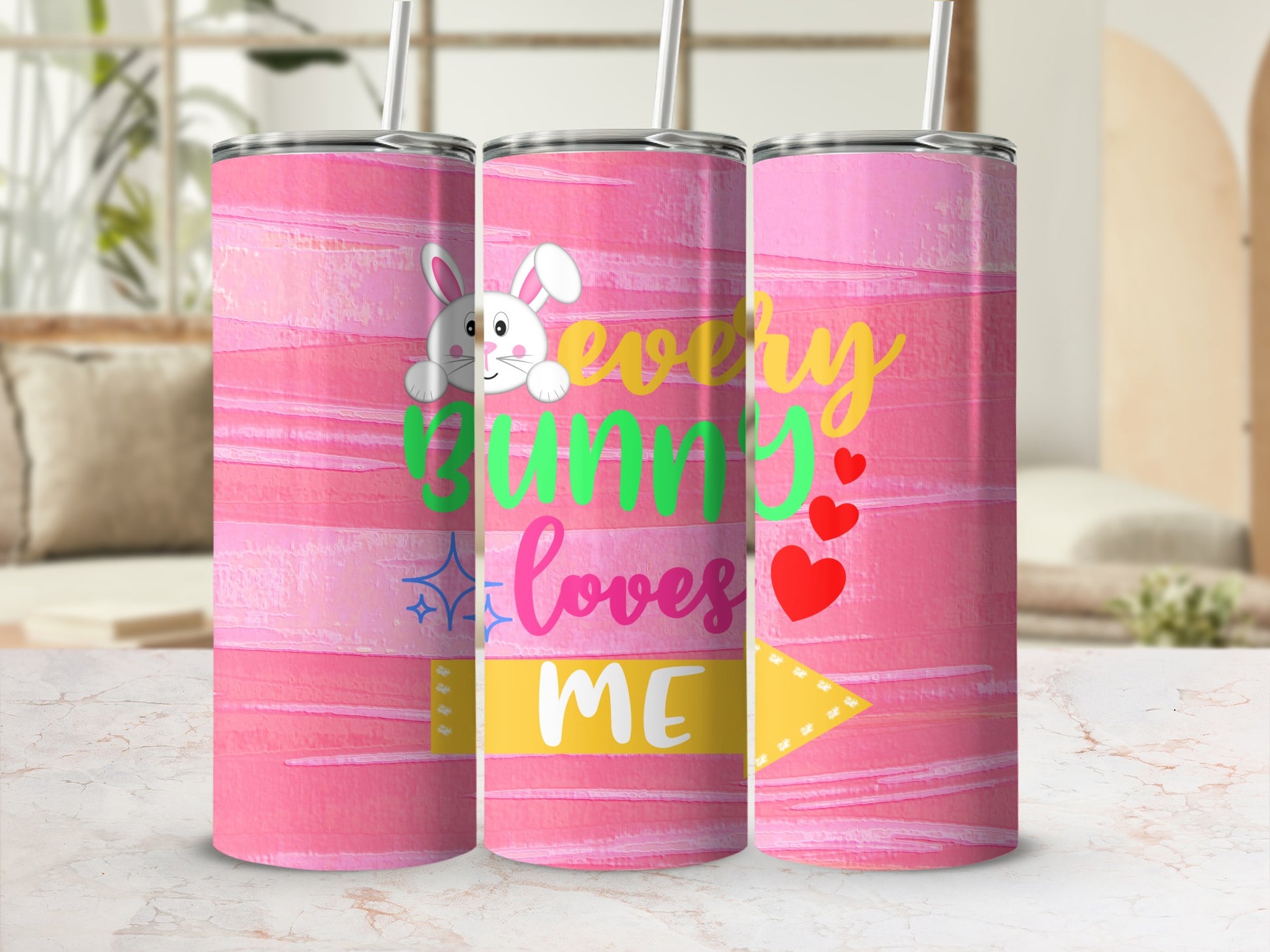 Pink tumbler with "every bunny loves me" text and Easter bunny graphic.