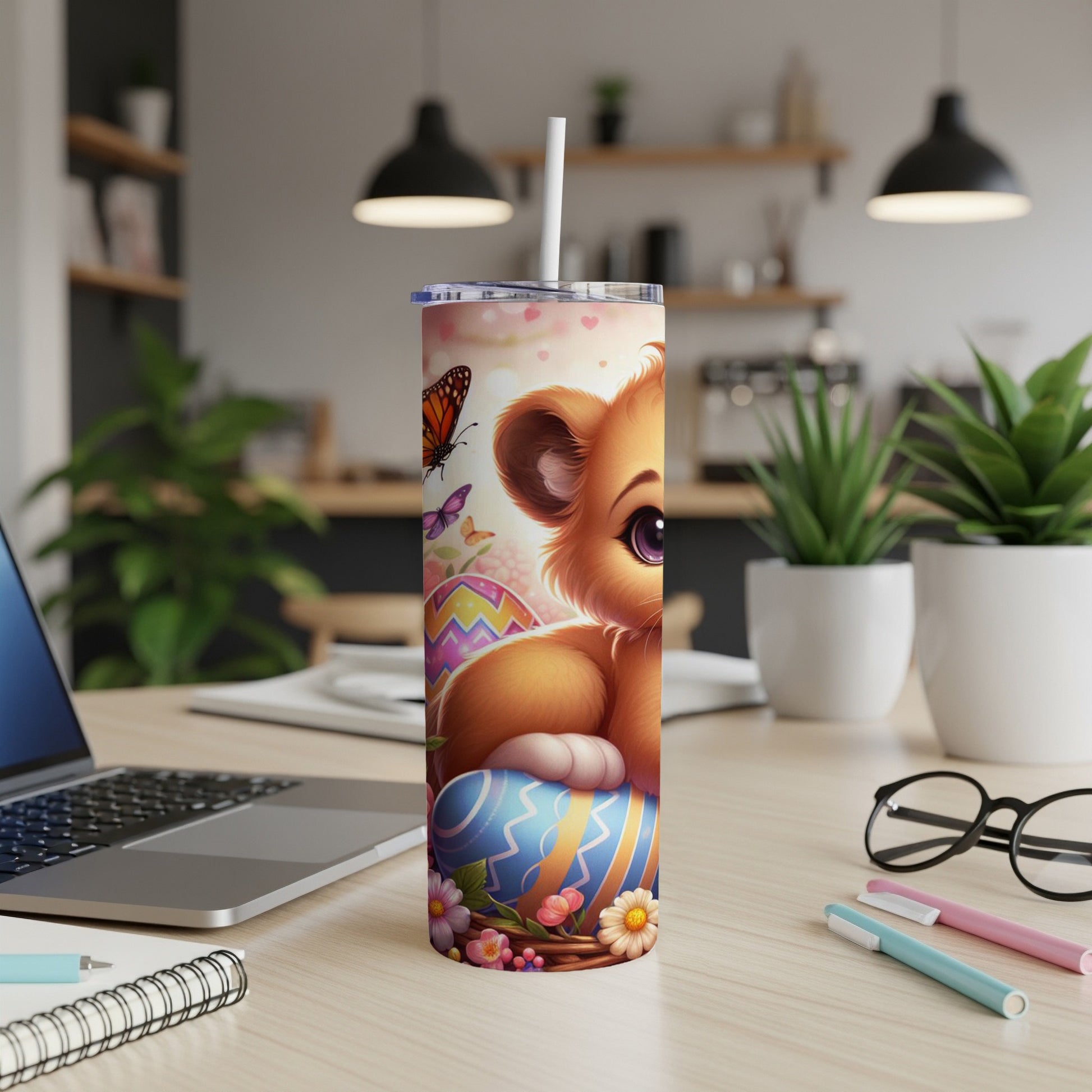 Cute cartoon lion cub with Easter eggs and butterflies on a tumbler.