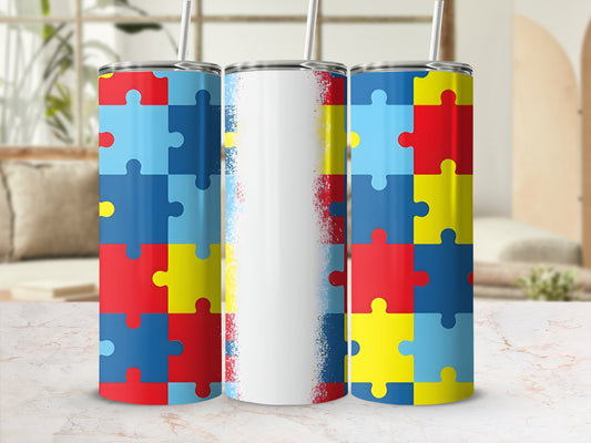 Three tumblers with autism puzzle piece designs and a white middle tumbler.