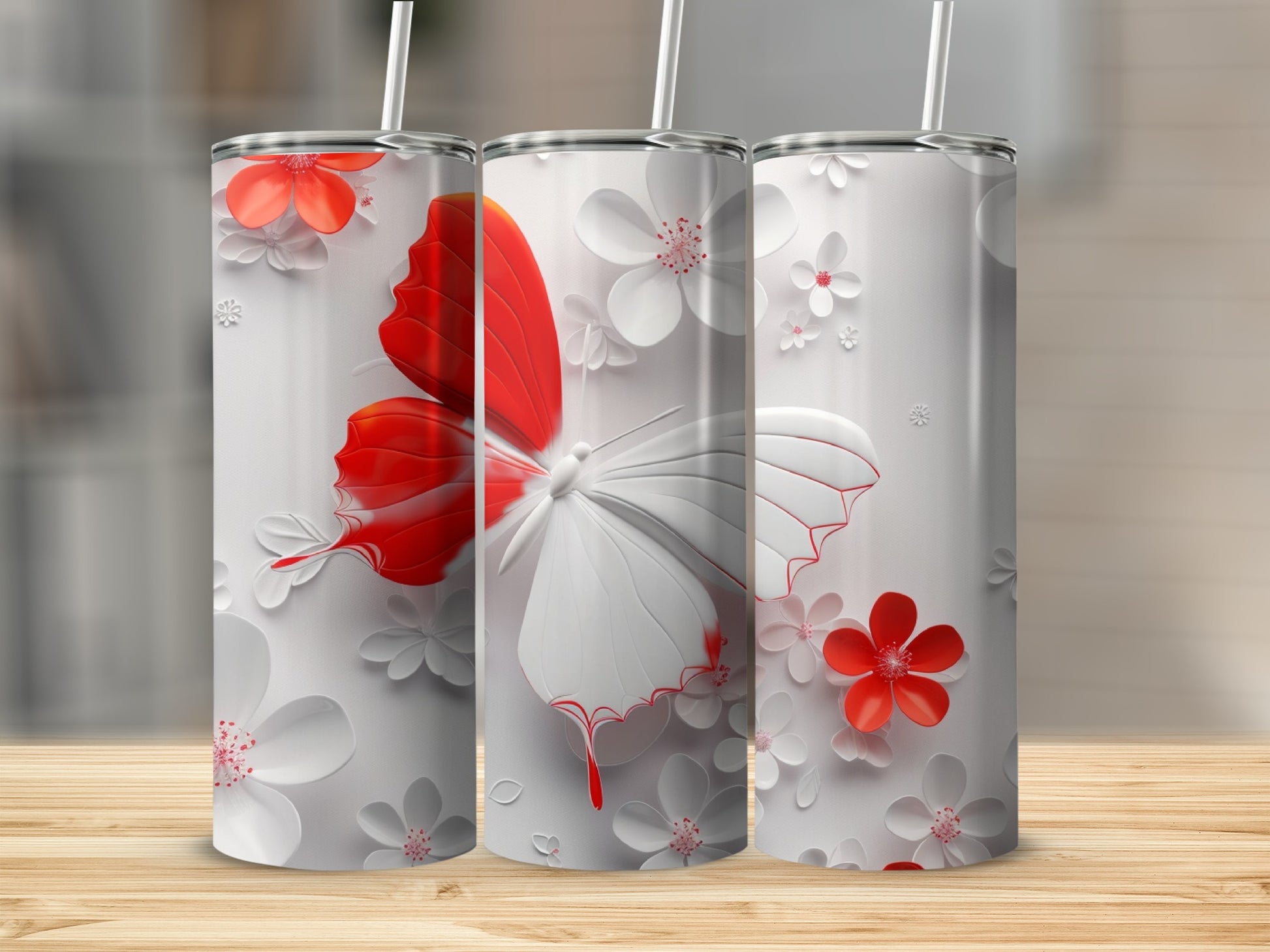 White tumbler with red butterfly and floral design.