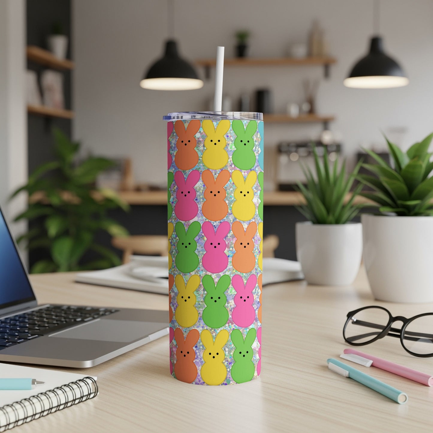 Colorful Easter bunny pattern on a white tumbler with a straw.