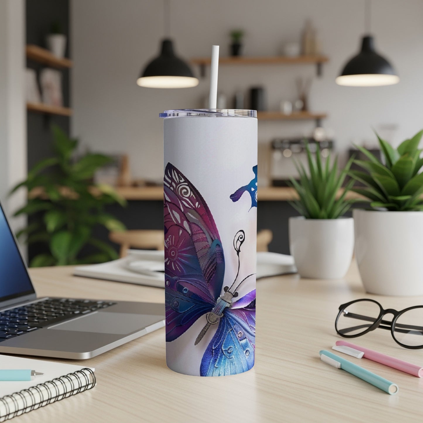 White tumbler with a vibrant purple and blue butterfly design.