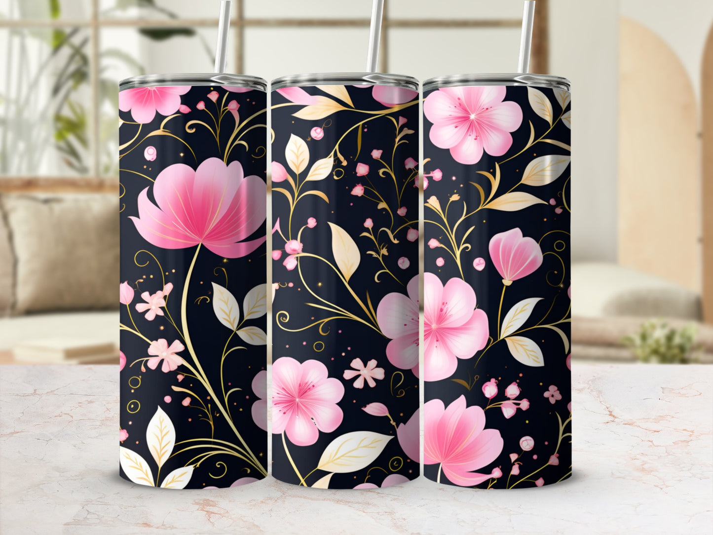 Three tumblers with pink flowers and gold leaves on a dark background.