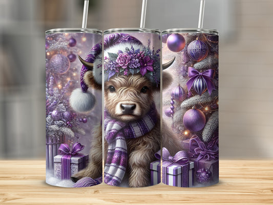 Christmas highland cow tumbler with purple accents and gifts.