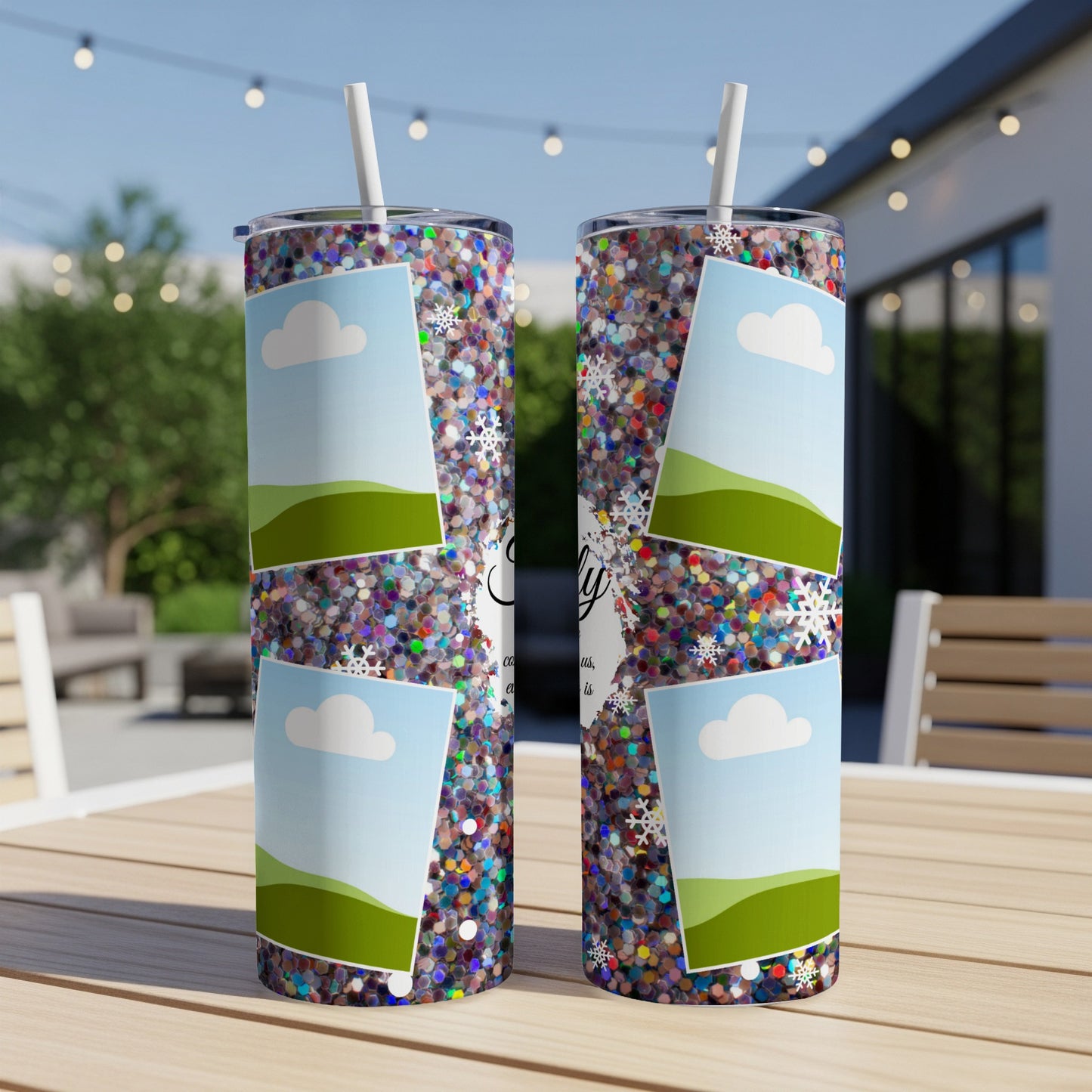 Two glitter tumblers with cloud and landscape photo frames and snowflake accents.