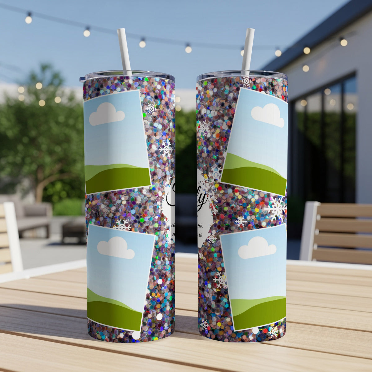 Two glitter tumblers with cloud and landscape photo frames and snowflake accents.