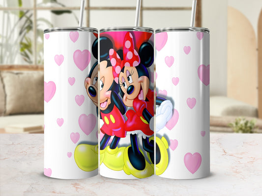 Mickey and Minnie Mouse smiling, surrounded by pink hearts, on a white tumbler.