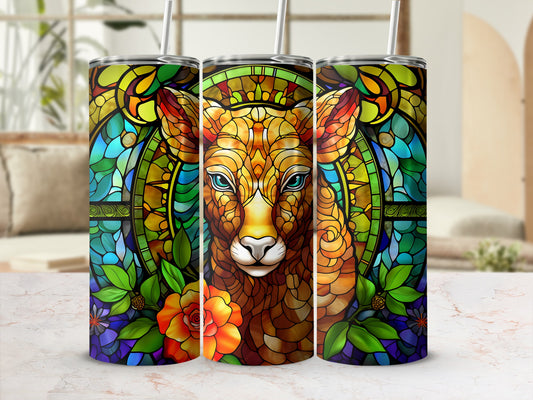 Lion head in stained glass design with floral accents on a tumbler.