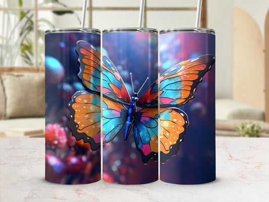 Three tumblers featuring a colorful butterfly design on a blurred background.