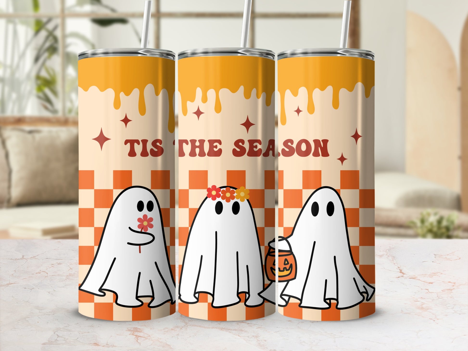 Three tumblers with ghosts, a flower crown, and a pumpkin bucket with "Tis the Season" text.