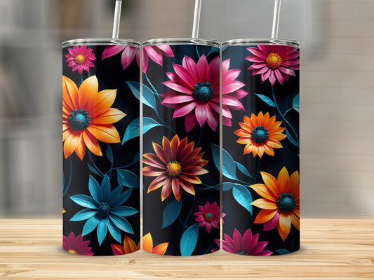 Three tumblers with vibrant floral patterns on a wooden surface.