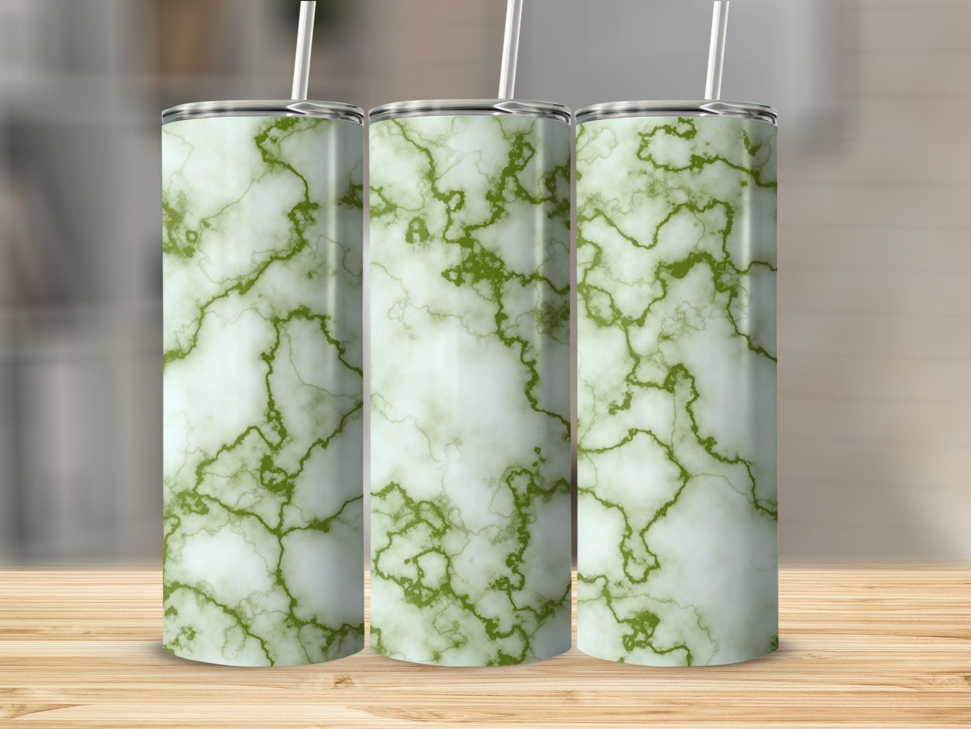 Three tall tumblers with green marble pattern and white straws.
