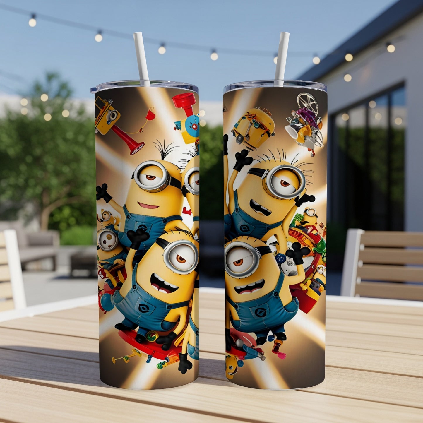 Two Minion-themed tumblers with straw on a wooden table, bright background.