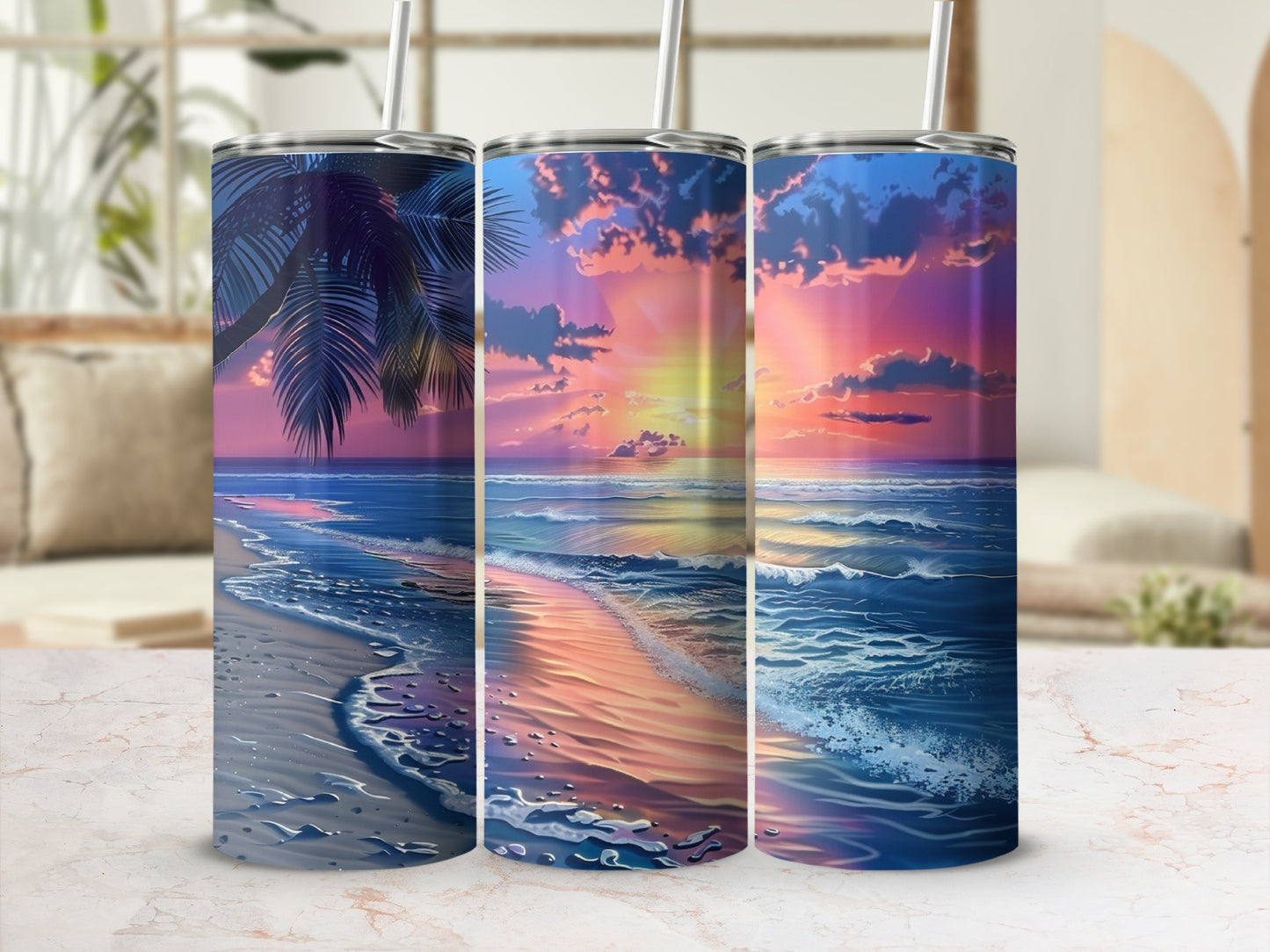 Three tumblers featuring a vibrant sunset over a sandy beach with ocean waves.