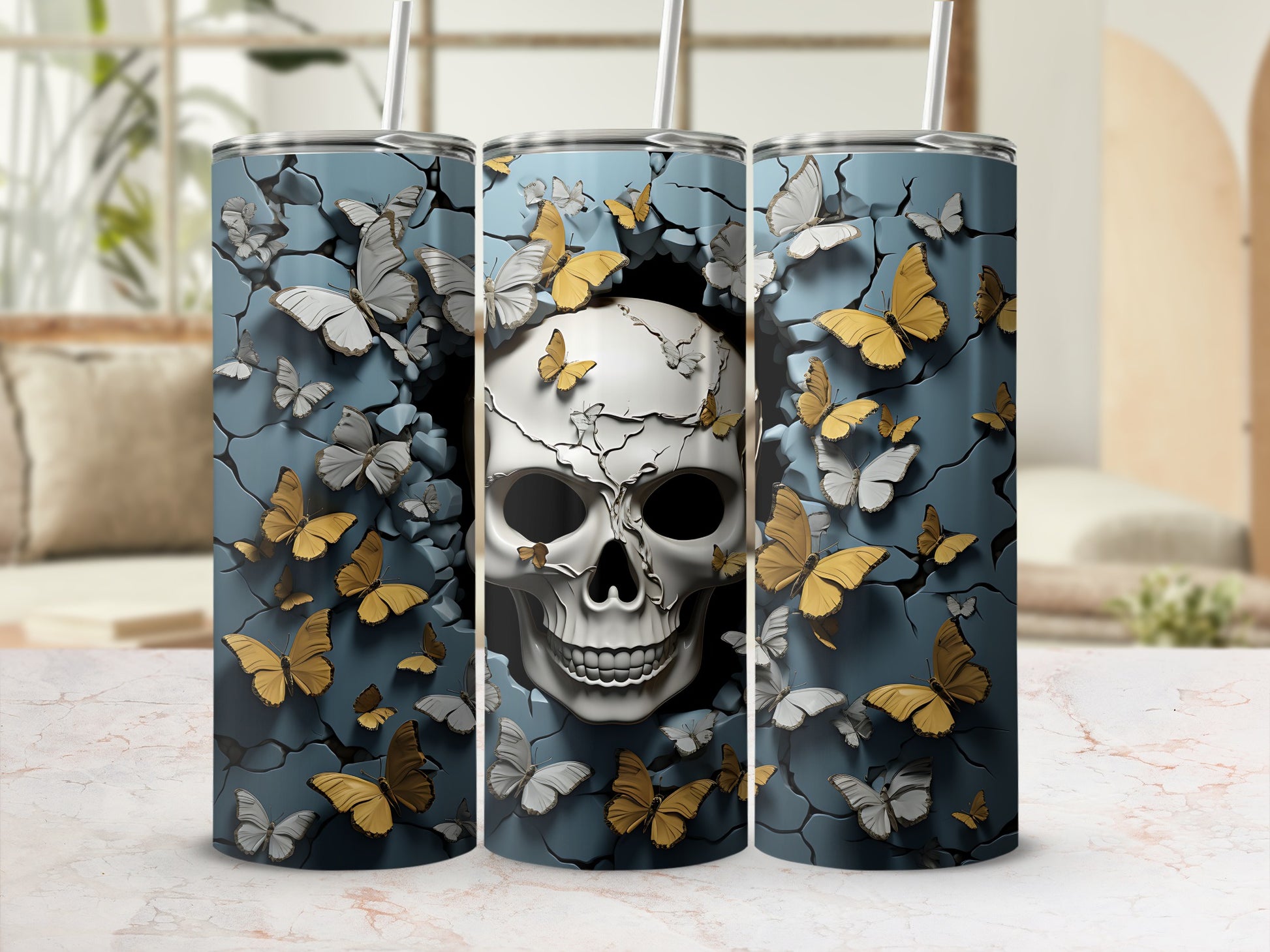 Three tumblers featuring a skull emerging from a cracked wall surrounded by butterflies.