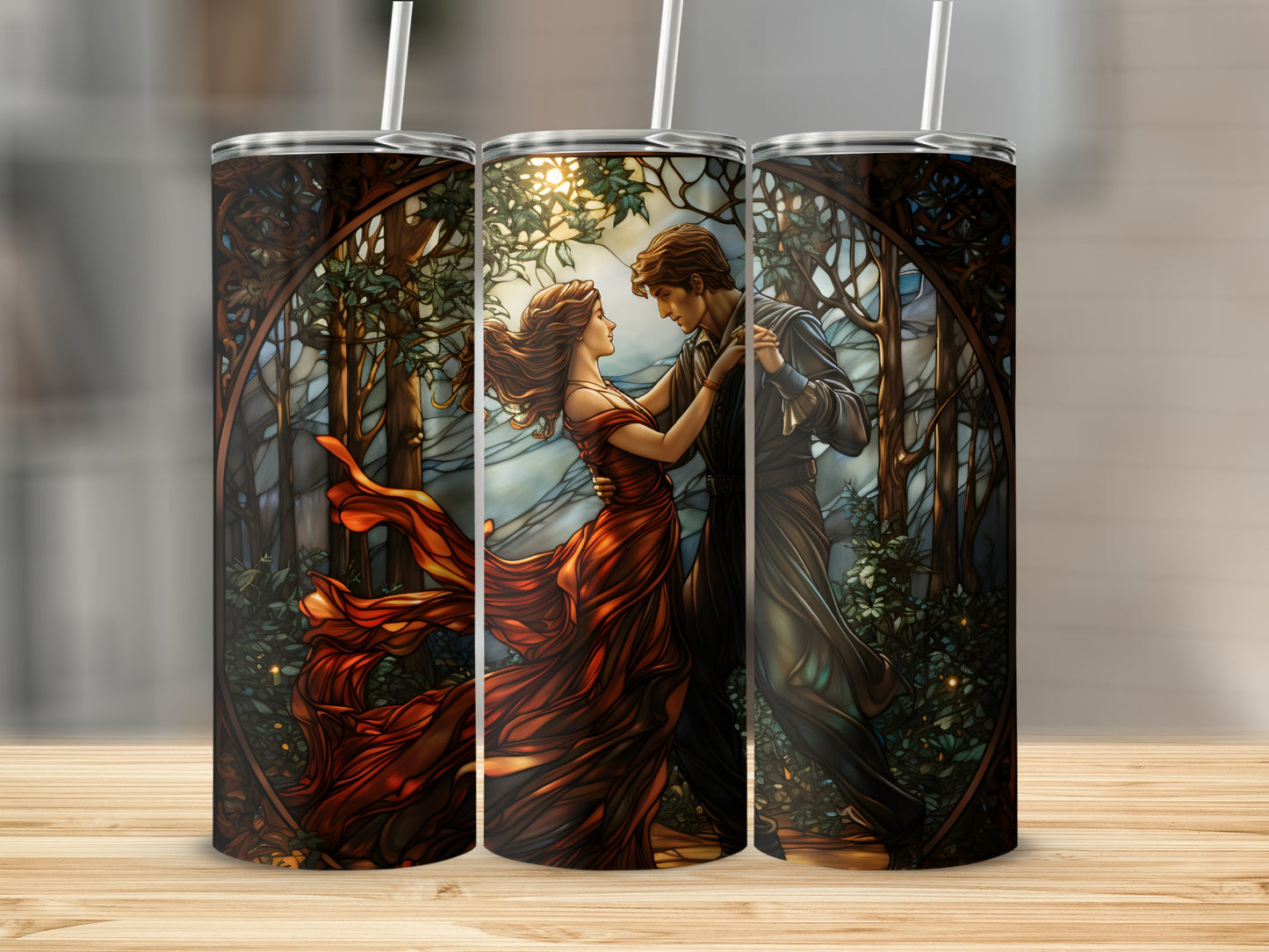 Couple dancing romantically in a forest stained glass design on three tumblers.