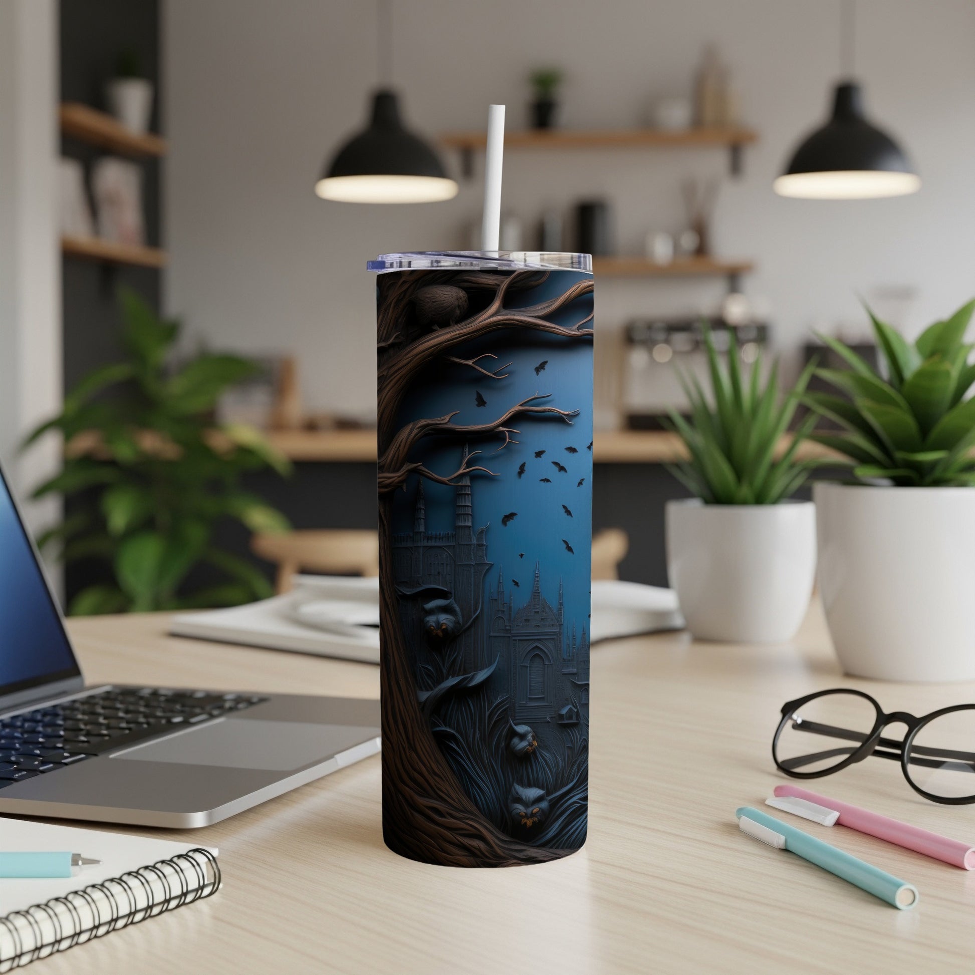 Tumbler with a dark, spooky scene featuring a castle and bats against a blue background.