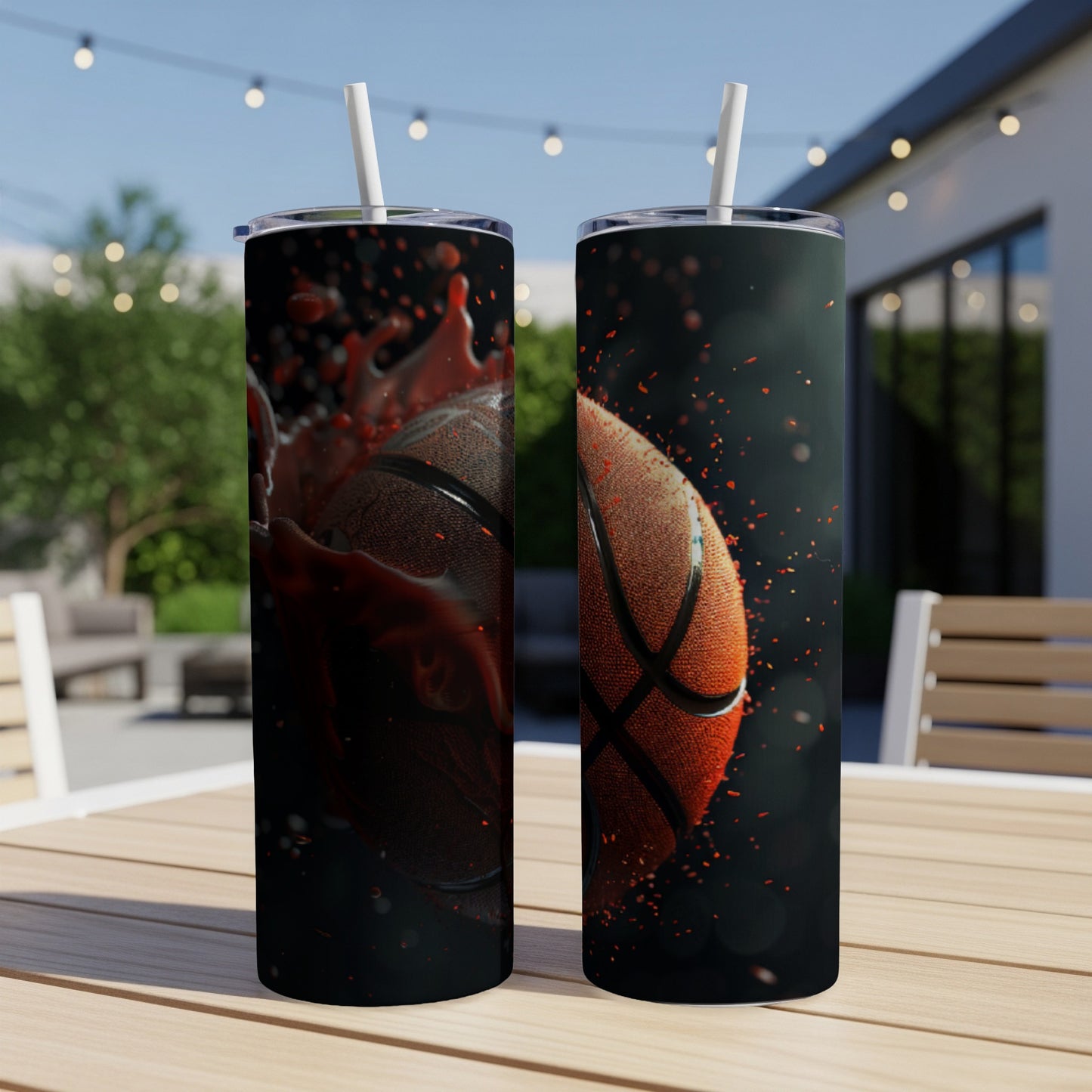 Two tumblers with a basketball design, one splashing red liquid.