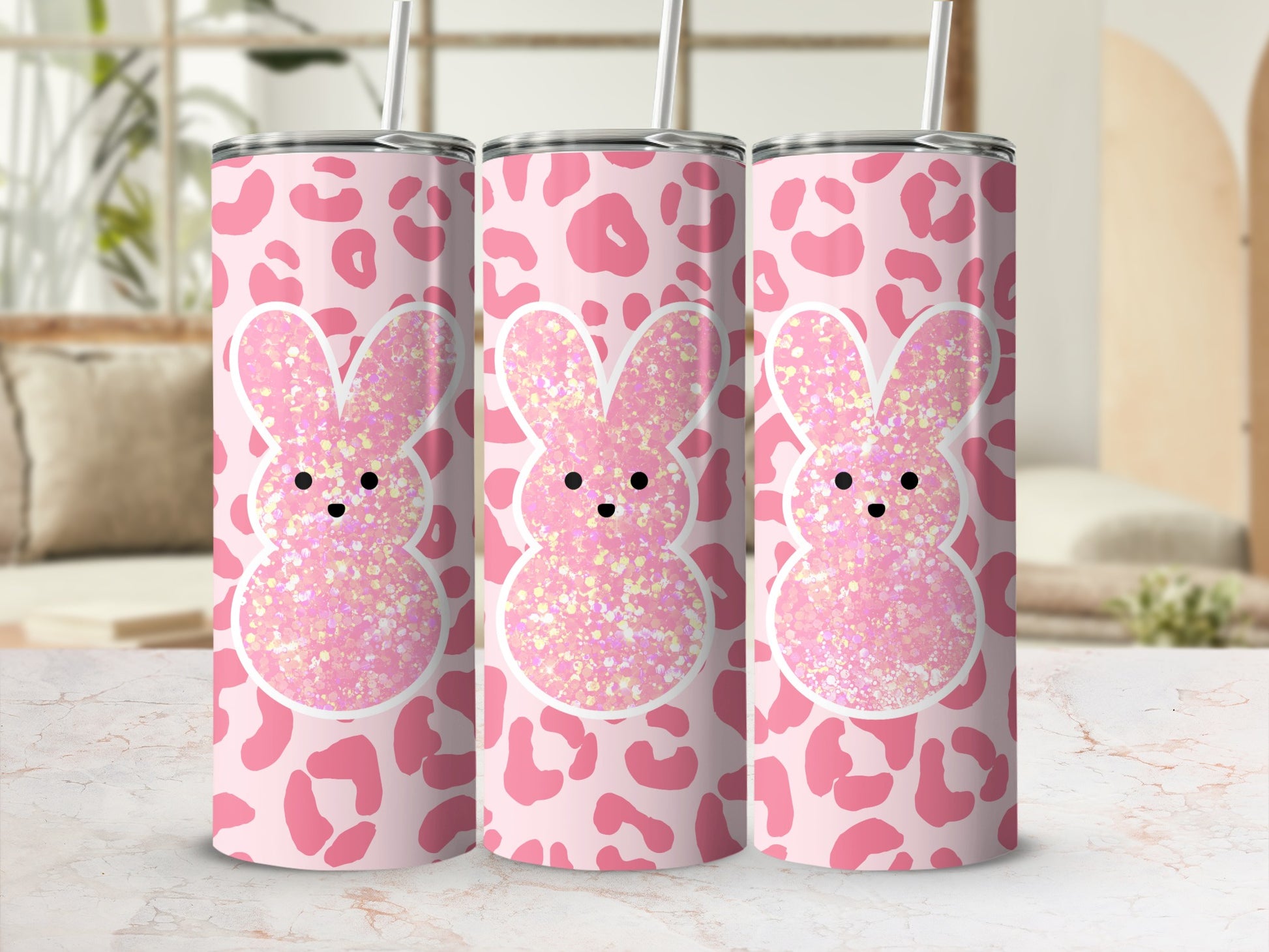 Pink leopard print tumbler with glitter bunny ears and eyes.