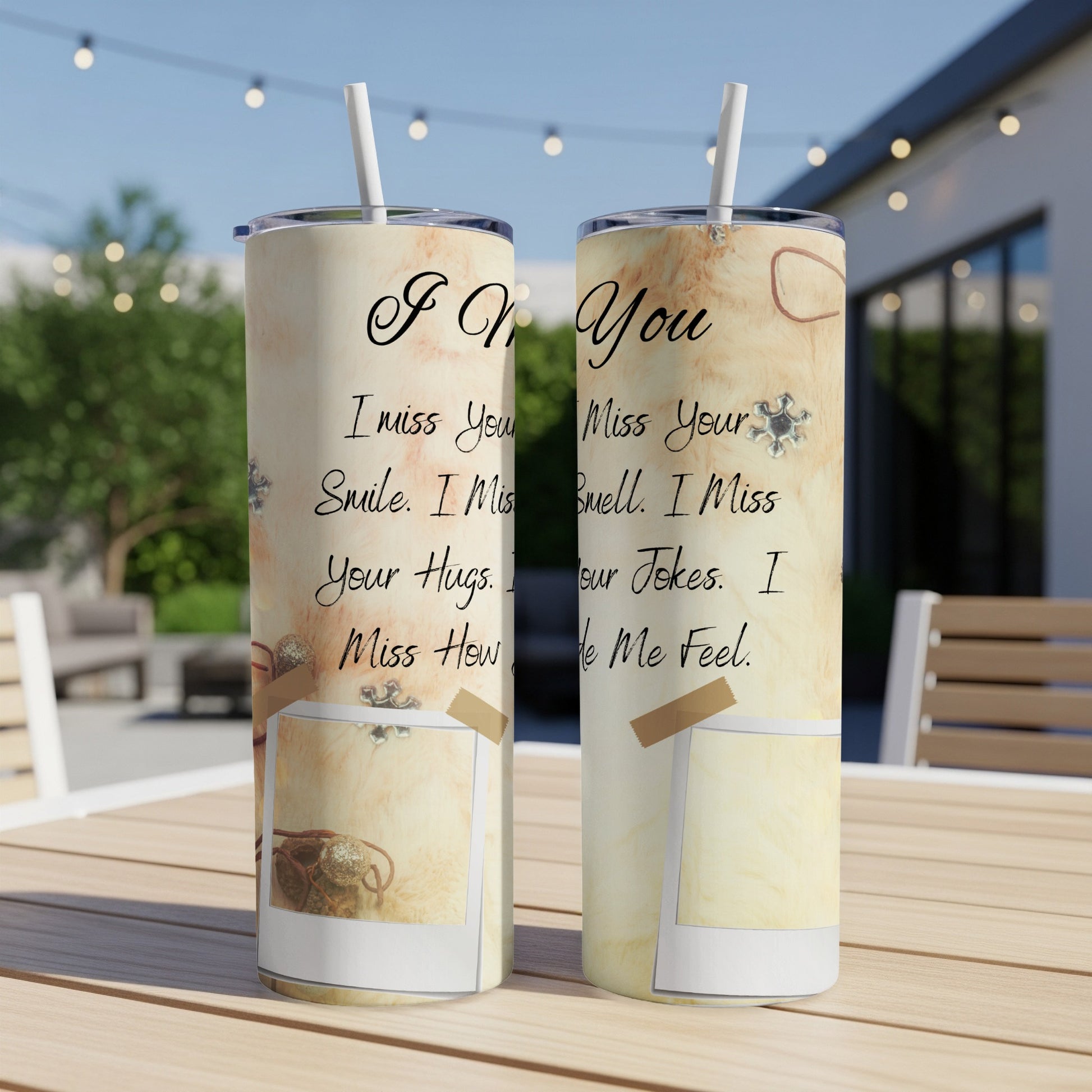 Two tumblers with "I Miss You" text and sentimental phrases on a wooden table.
