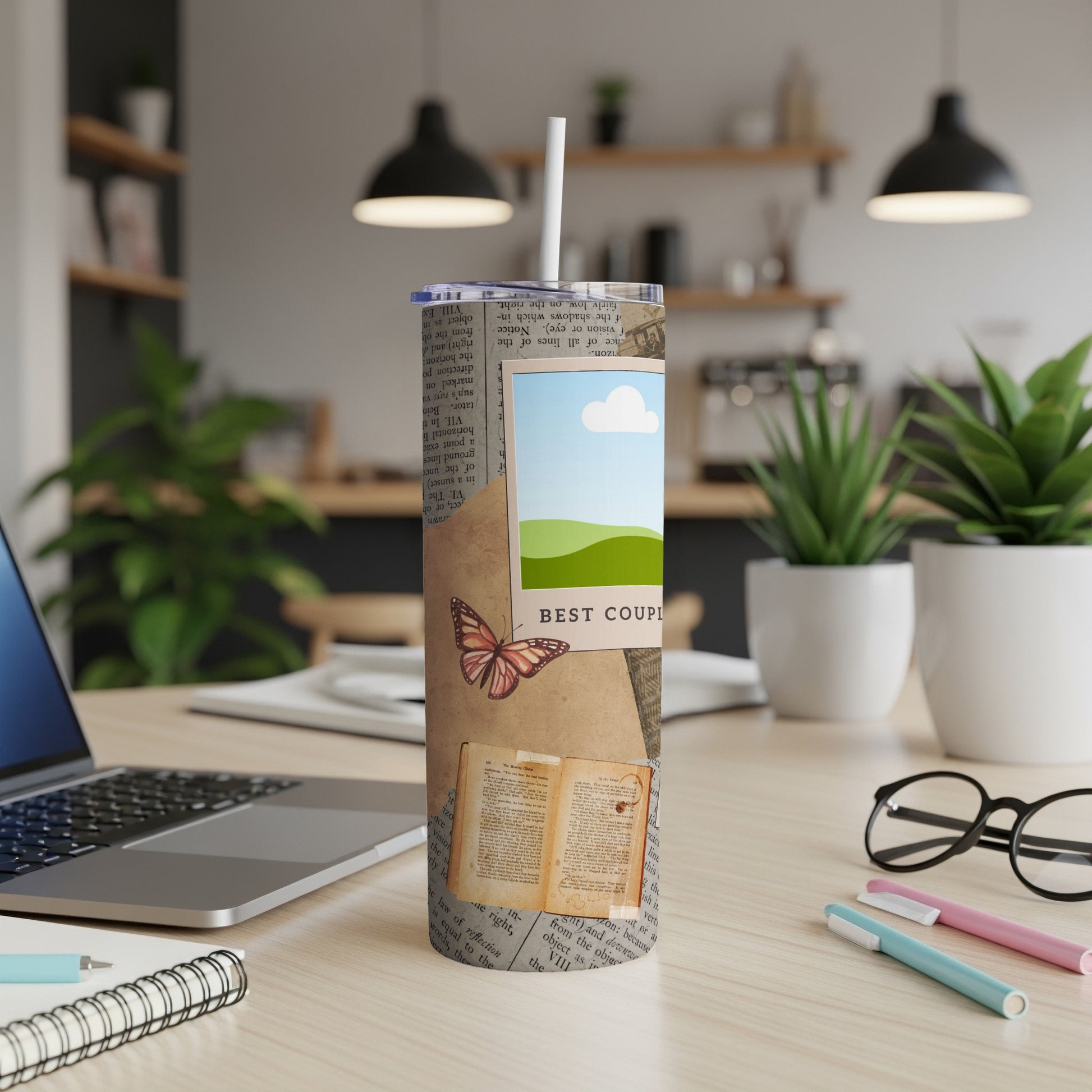 Tumbler with newspaper print, butterfly, open book, and "Best Couple" text.