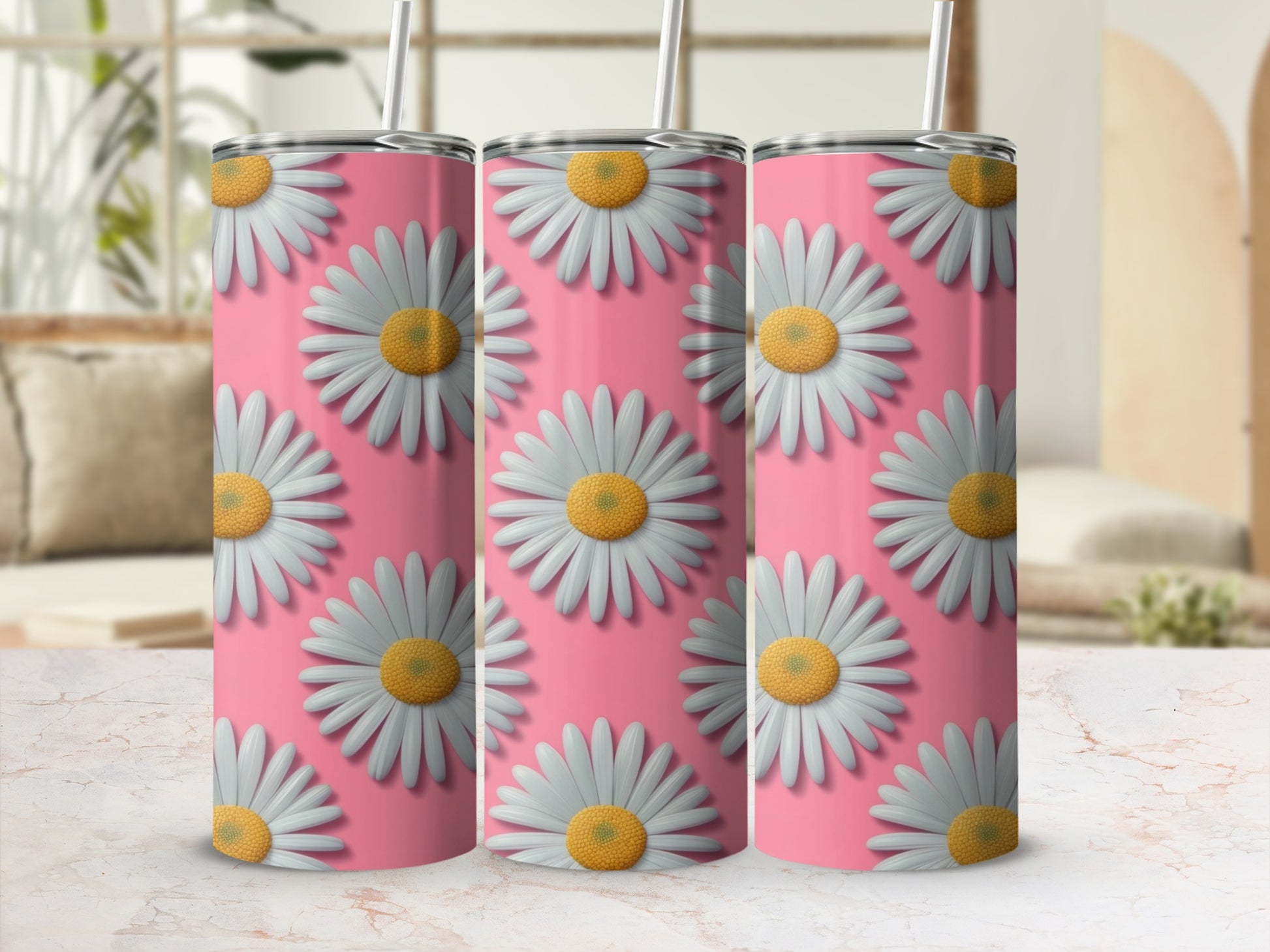 Three pink tumblers with a repeating daisy flower pattern.
