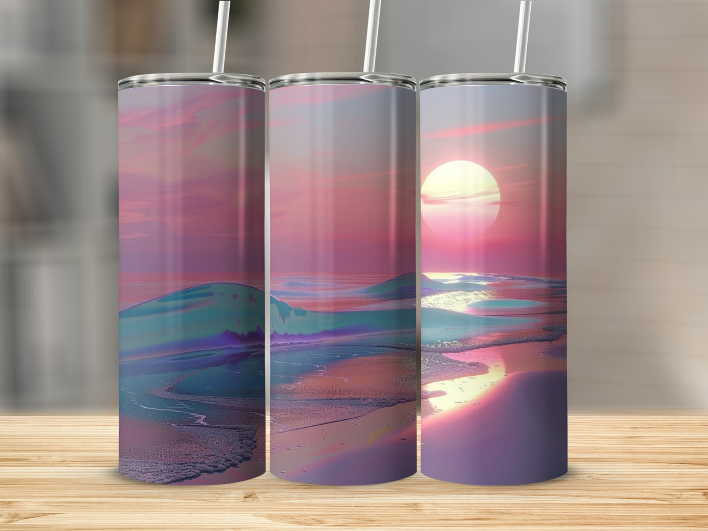 Three tumblers with a sunset beach scene and abstract ocean waves.