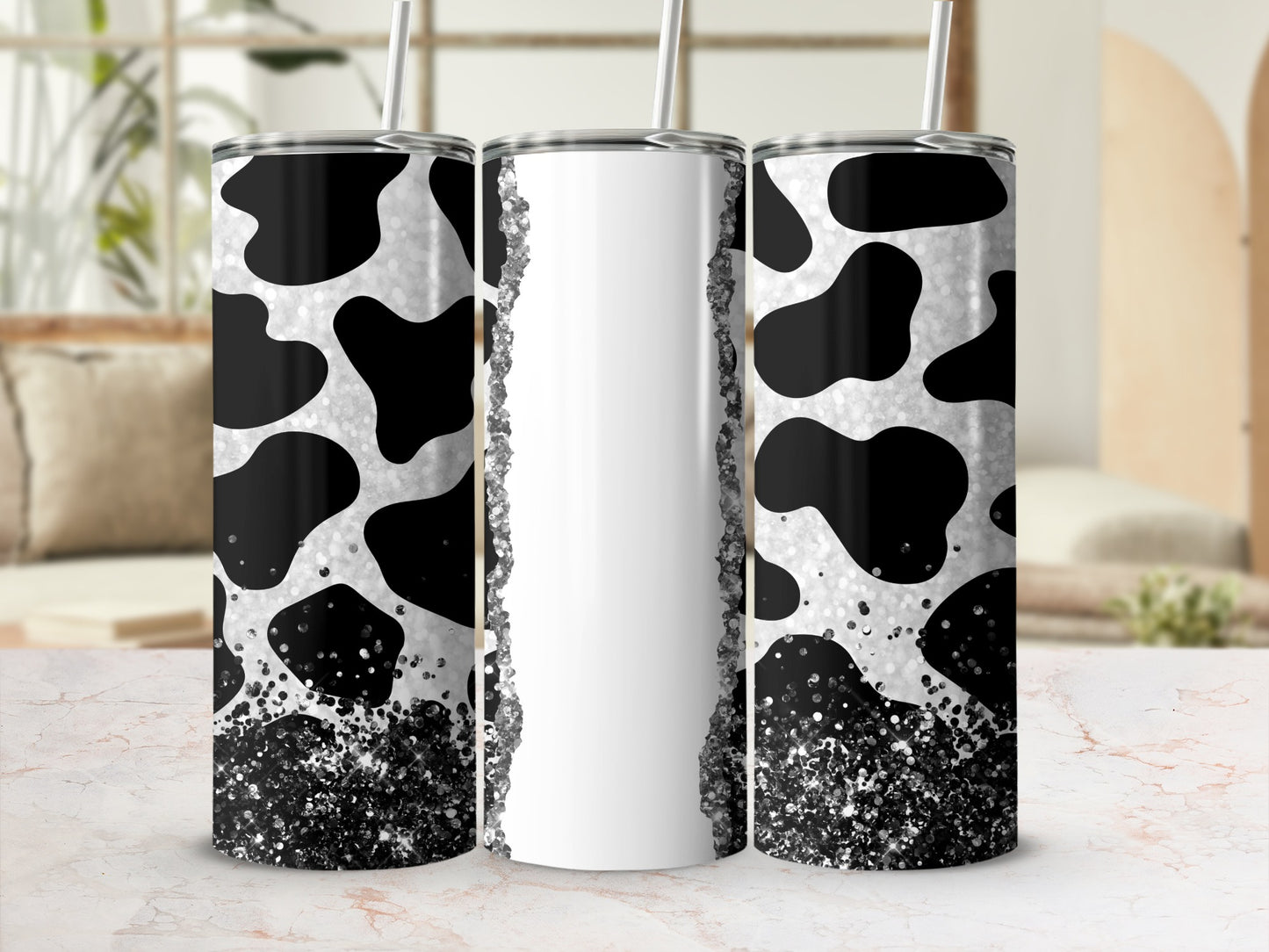 Triptych of tumblers with cow print and glitter accents.