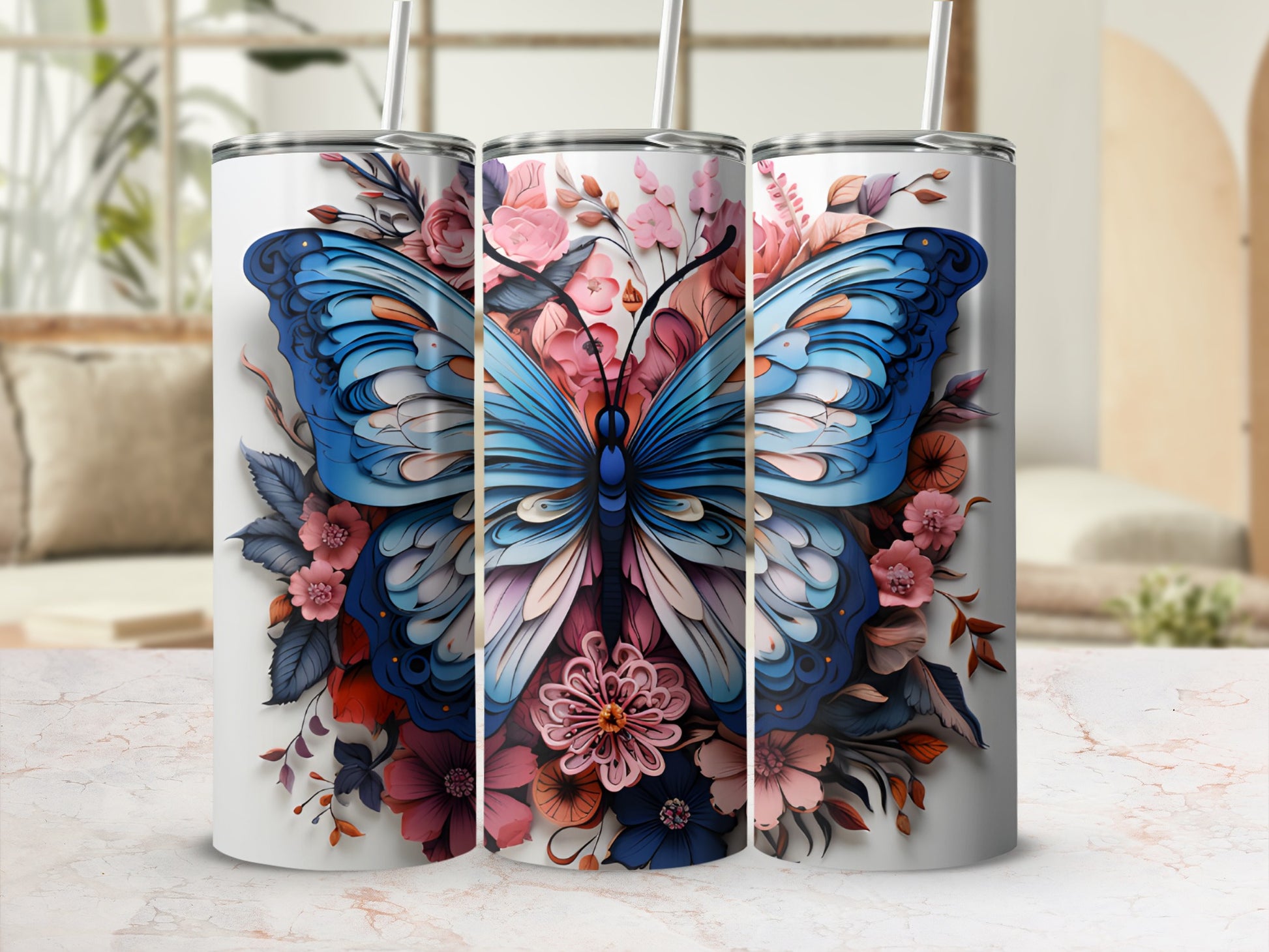 Three tumblers with a blue butterfly and floral design.