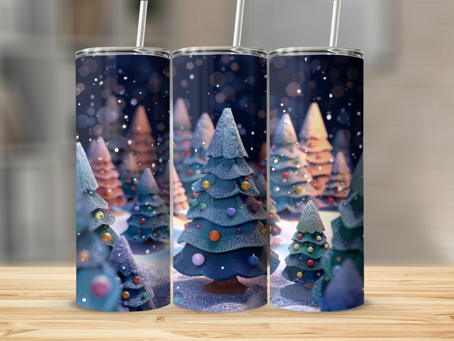 Three holiday tumblers with a whimsical snowy forest scene.