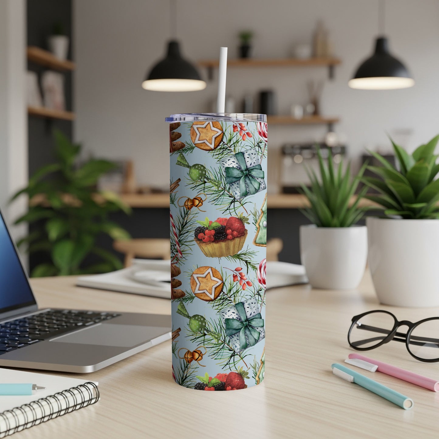 Christmas-themed tumbler with berries, gingerbread cookies, and gift bows.