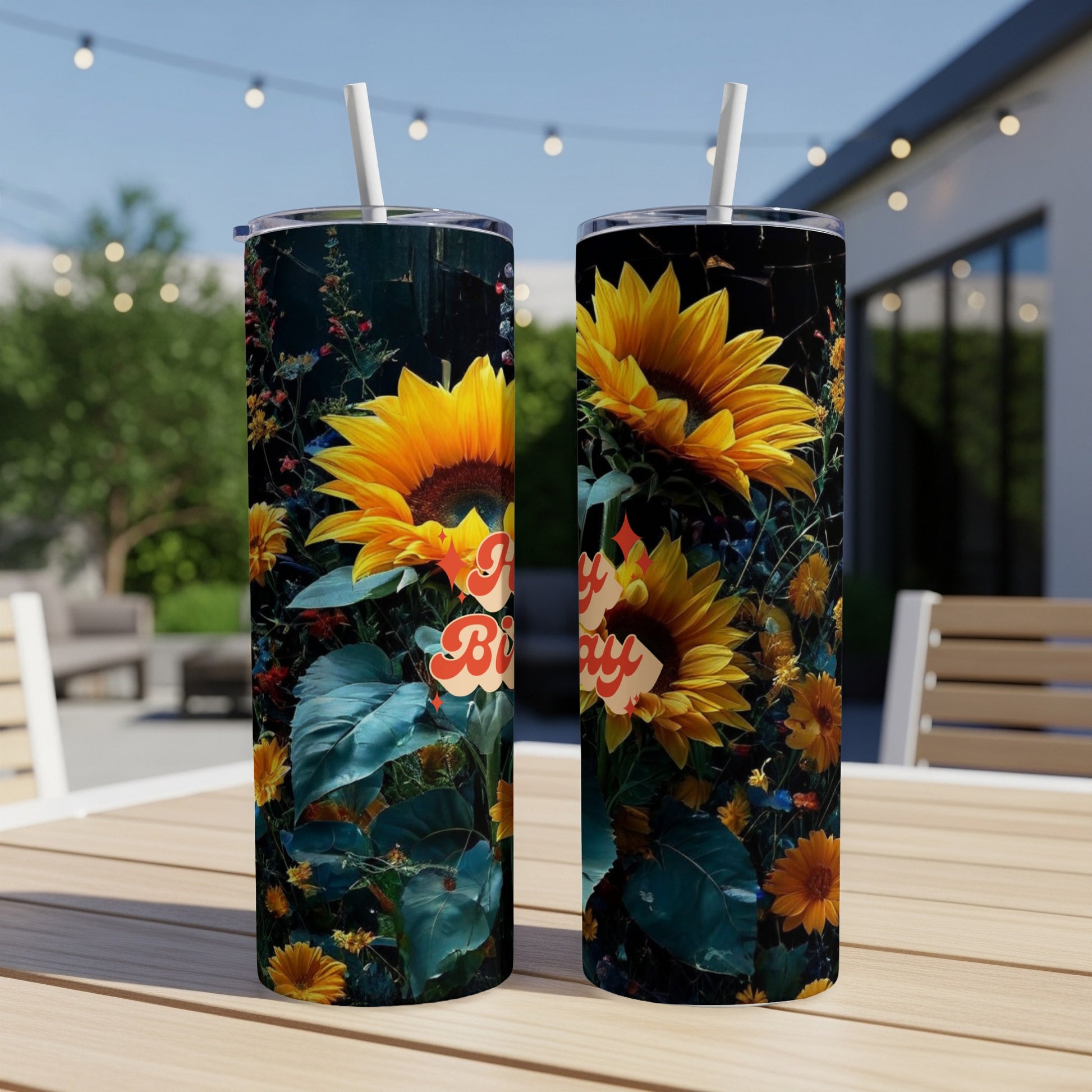 Two tumblers with sunflowers and "Bee Kind" text on a table.