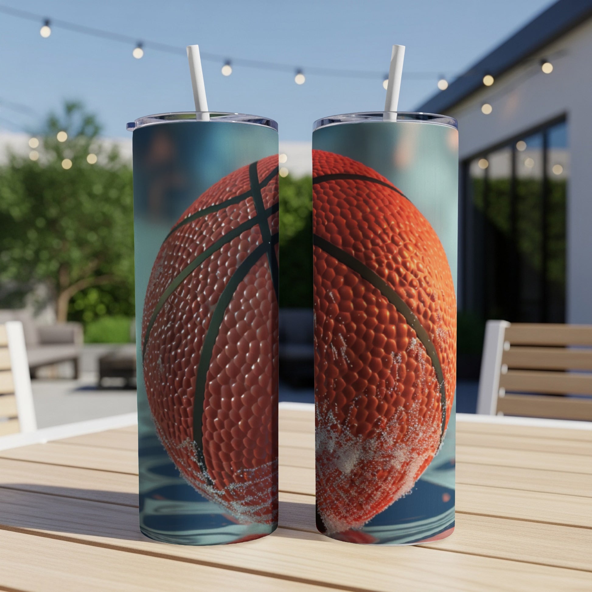 Two tumblers with a close-up basketball design on a wooden table.