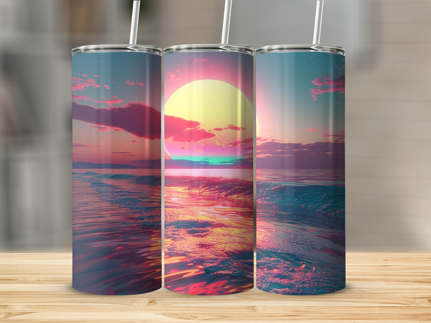 Three tumblers display a vibrant sunset over a shimmering ocean.