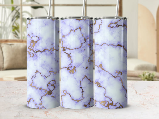 Tumbler with purple and gold marble design, on a light surface.