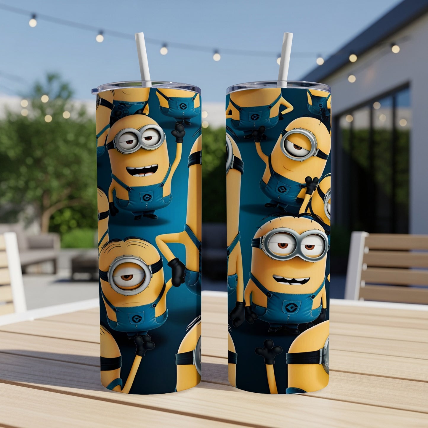 Two Minions tumblers with straw on a table, patterned with Minions.