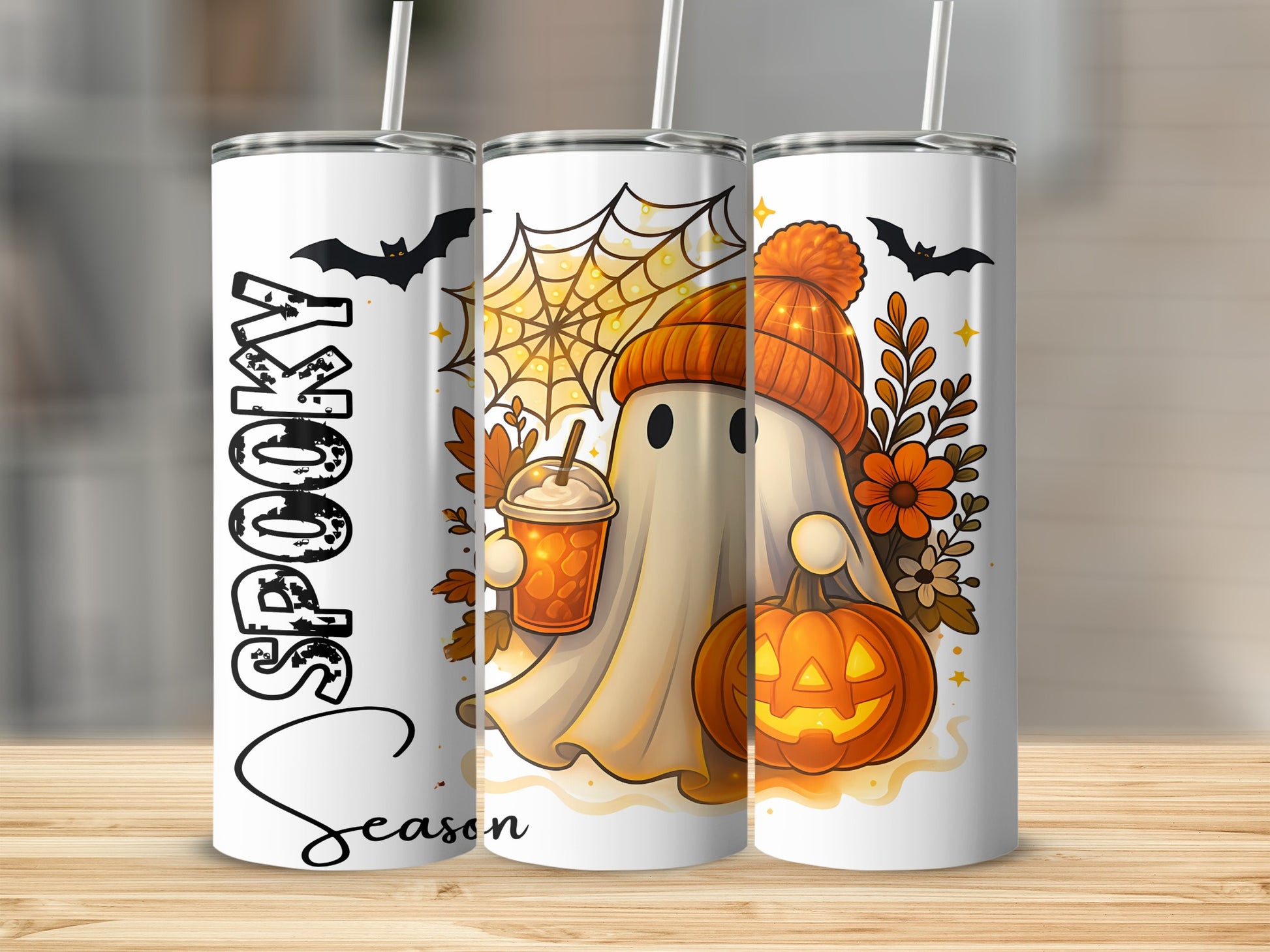 "Spooky Season" text on a tumbler with a ghost, pumpkin, and drink.